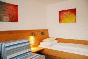 Basic single with balcony, private facilities (bath and shower), and breakfast