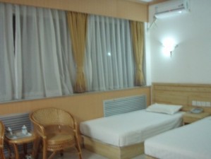 Deluxe twin with city view, king bed, private facilities (bath and shower), and breakfast