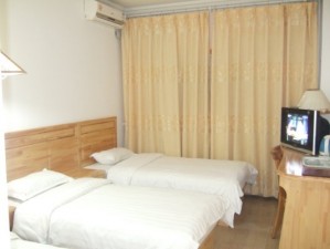 Deluxe triple with city view, king bed, private facilities (bath and shower), and breakfast