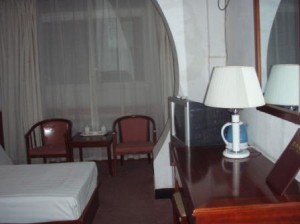Deluxe double with city view, queen bed, and private facilities (bath and shower)
