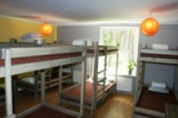 Bed in a budget dormitory with garden view, and shared facilities