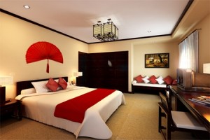 Deluxe double with city view, king bed, and private facilities (bath and shower)