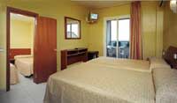 Family quad with sea view, balcony, private facilities (shower), and breakfast