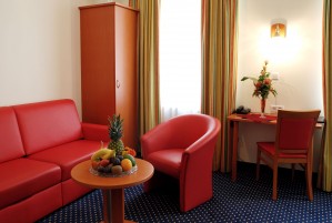 3 person standard 2 room suite with city view, king bed, and private facilities (bath)