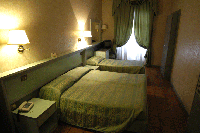 Standard triple with king bed, and private facilities