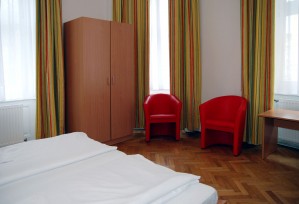 3 person comfort 2 room suite with city view, french bed, and private facilities (shower)