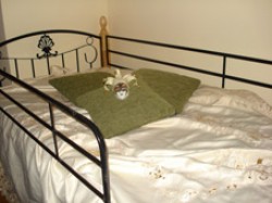 Bed in a budget dormitory with shared facilities