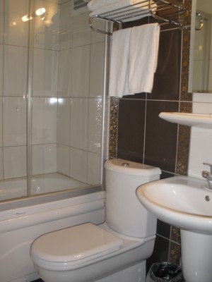 Standard 5 room triple with city view, french bed, and private facilities (bath and shower)