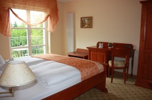 Comfort double with garden view, balcony, and private facilities (bath and shower)