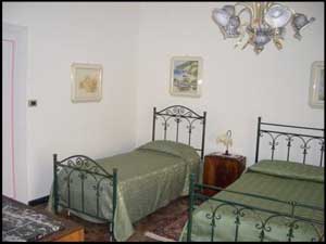 Standard quad with garden view, terrace, private facilities (bath and shower), and breakfast
