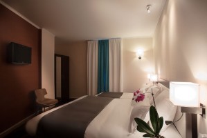 Deluxe triple with patio view, and private facilities (bath and shower)