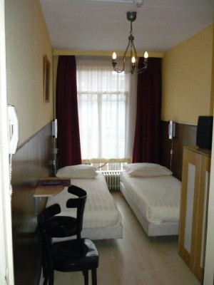 Small twin with private shower shared toilet, and breakfast