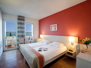 Superior twin with sea view, balcony, private facilities (shower), and full board