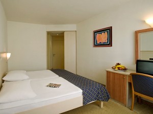 Standard twin with garden view, balcony, private facilities (bath), and half board