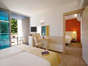 Superior double or twin and 2 children with garden view, balcony, private facilities (bath and shower), and half board
