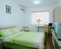 2 person comfort studio with city view, queen bed, and private facilities (bath and shower)