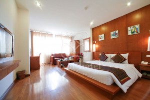 2 person king size suite and 1 child with city view, balcony, and private facilities (bath and shower)